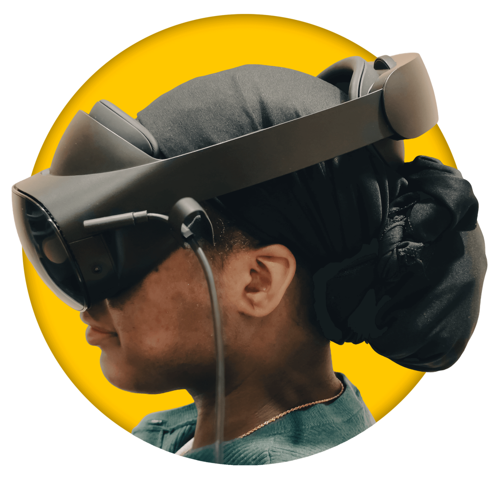 Person wearing VR headset against yellow background